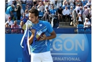 EASTBOURNE, ENGLAND - JUNE 21:  Feliciano Lopez of Spain celebrates with the trophy after beating Richard Gasquet of France during their Men's Singles Finals match on day eight of the Aegon International at Devonshire Park on June 21, 2014 in Eastbourne, England. (Photo by Jan Kruger/Getty Images)